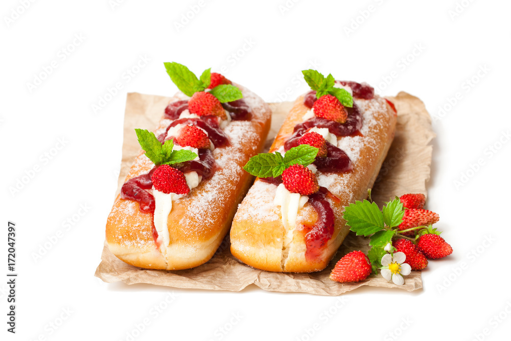 Custard filled doughnuts with wild strawberry isolated on white Custard filled doughnuts with wild strawberry isolated on white