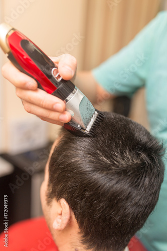 Man's haircut trimmer in the beauty salon