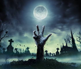 Zombie Hand Rising Out Of A Graveyard
