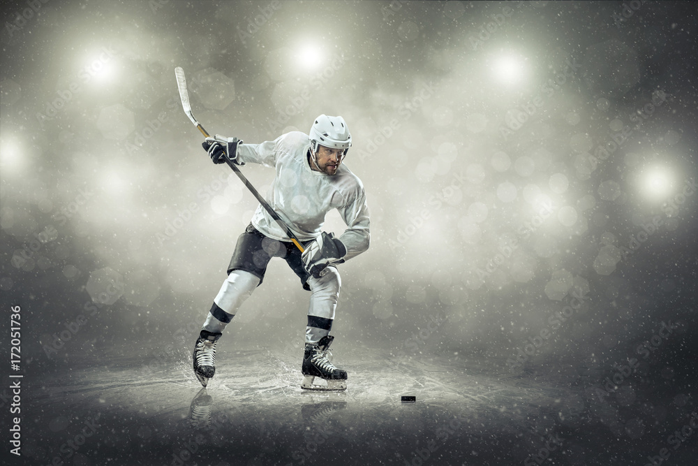 Ice hockey player on the ice, outdoors Ice hockey player on the ice, outdoors