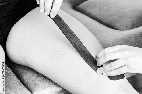 Lymphatic knee technique   The  Y  strip. Kinesiology Tape in silhouette