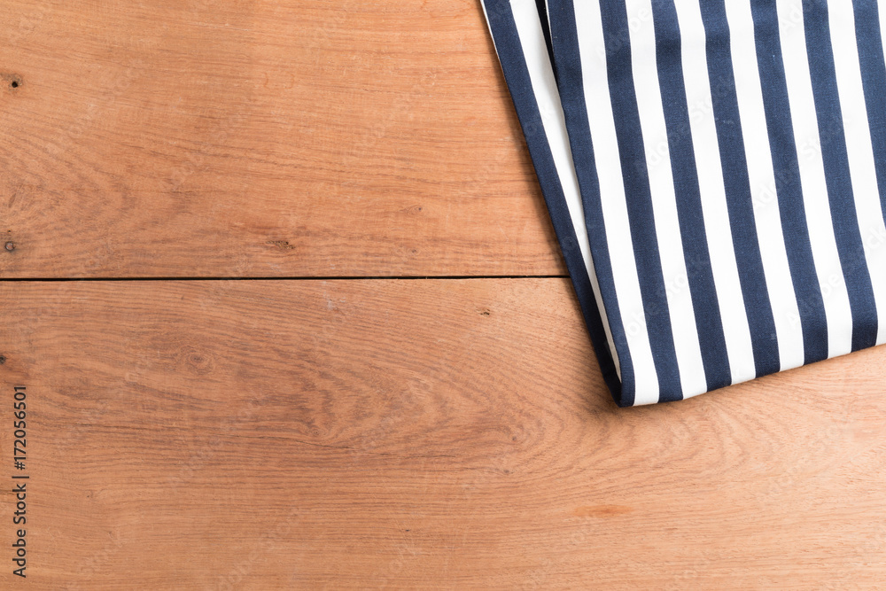 Obraz premium Tablecloths on the wooden table background