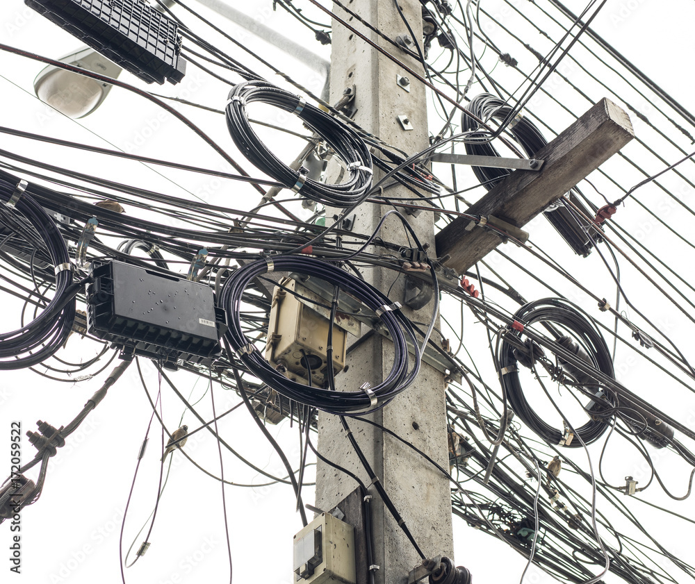 Electric pole cables and wires is tangle on sky background technology concept. Electric pole cables and wires is tangle on sky background technology concept.
