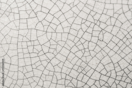Cracked white Ceramic of tile Close up background and texture