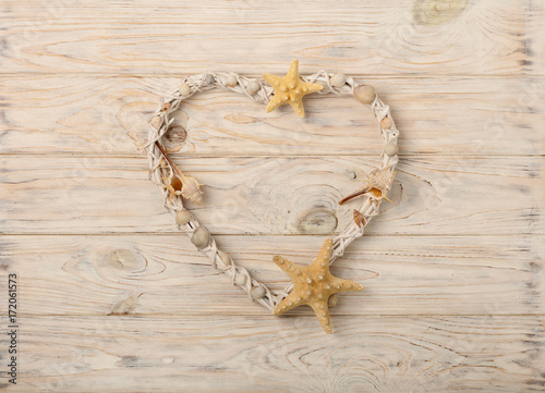 Valentine's Day. Decorative heart in a marine style from seashells, stones and sea stars.
