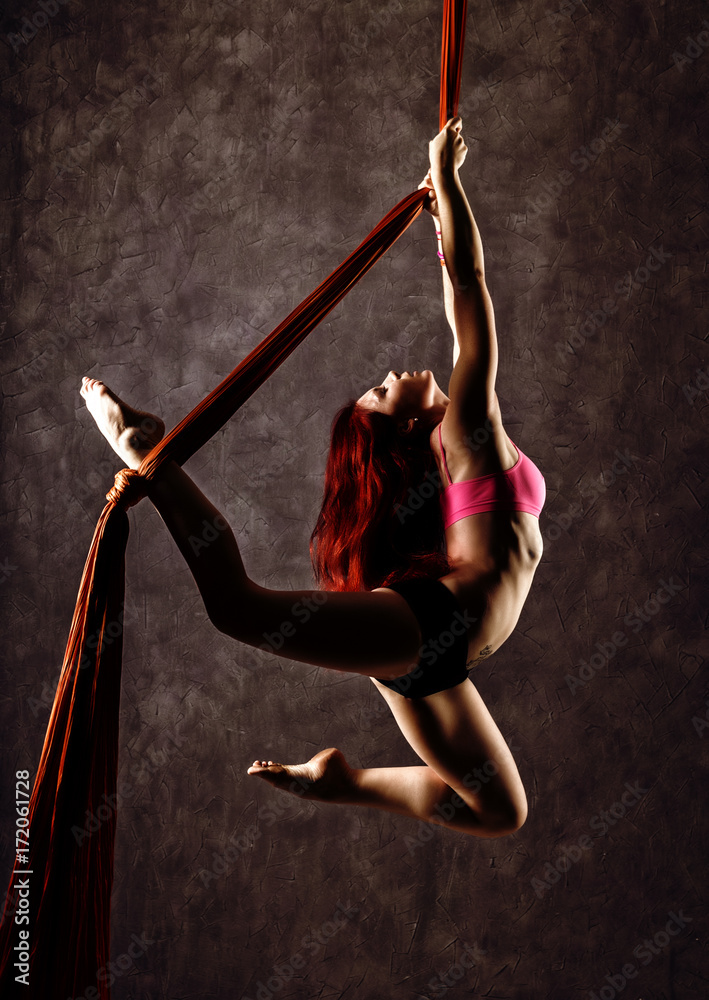 Beautiful sexy dancer on aerial silk, graceful contortion, acrobat performs  a trick on a ribbons Stock Photo | Adobe Stock