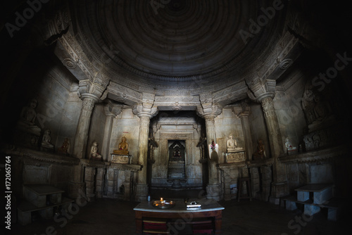Interior of the majestic jainist temple at Ranakpur, Rajasthan, India. Architectural details of stone carvings, ultra wide angle fish eye view.