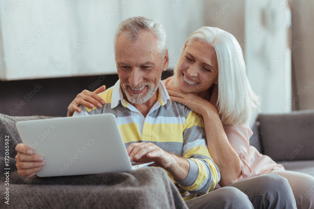 Pleasant aged loving couple resting at home Pleasant aged loving couple resting at home