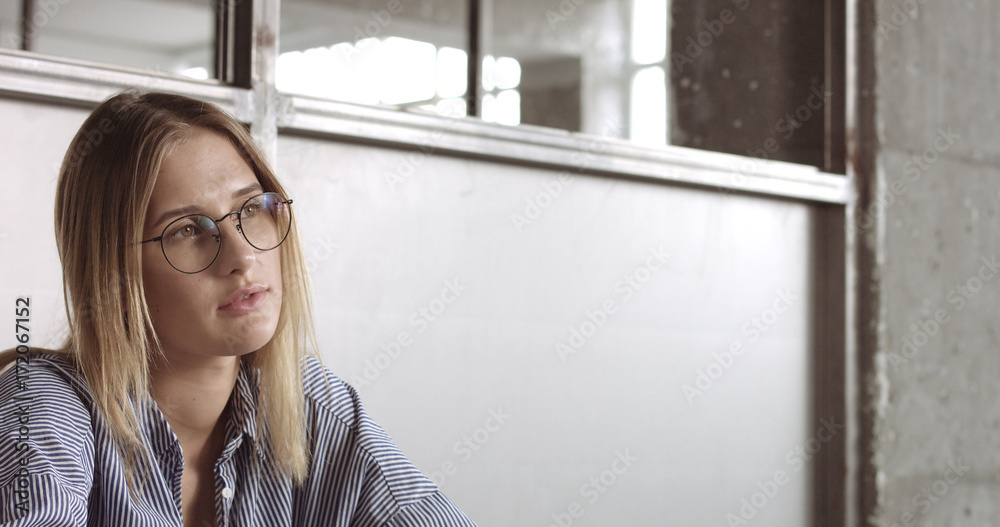 Beautiful young professional blond in glasseswoman portrait office style Beautiful young professional blond in glasseswoman portrait office style