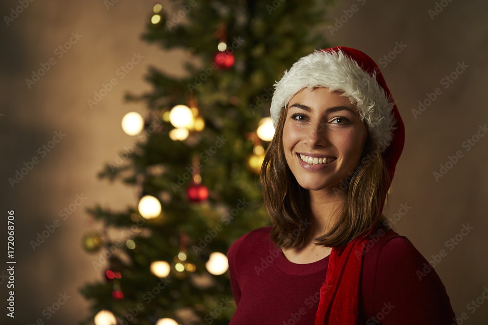 Christmas beautiful woman in Santa hat, portrait