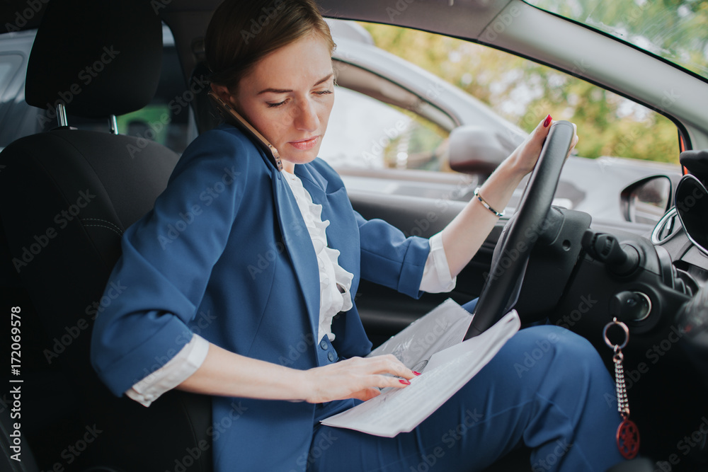 The driver going on the road, speaking on the phone, working with documents  at the same time. Businesswoman doing multiple tasks. Multitasking business  person. Stock Photo | Adobe Stock