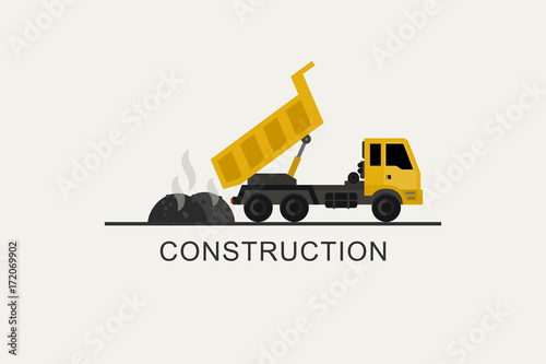 Construction truck unloads asphalt