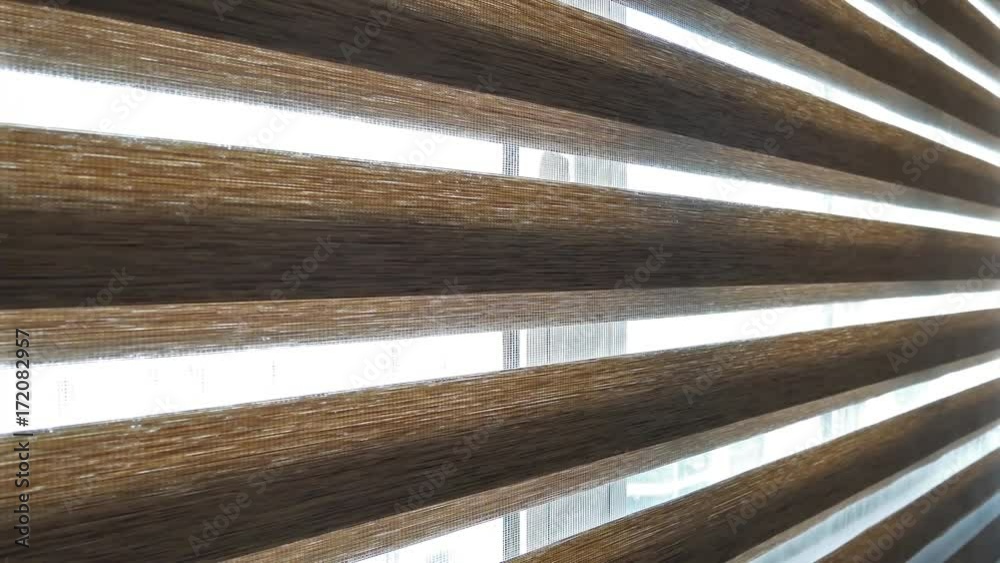 Opening window zebra blind curtain.