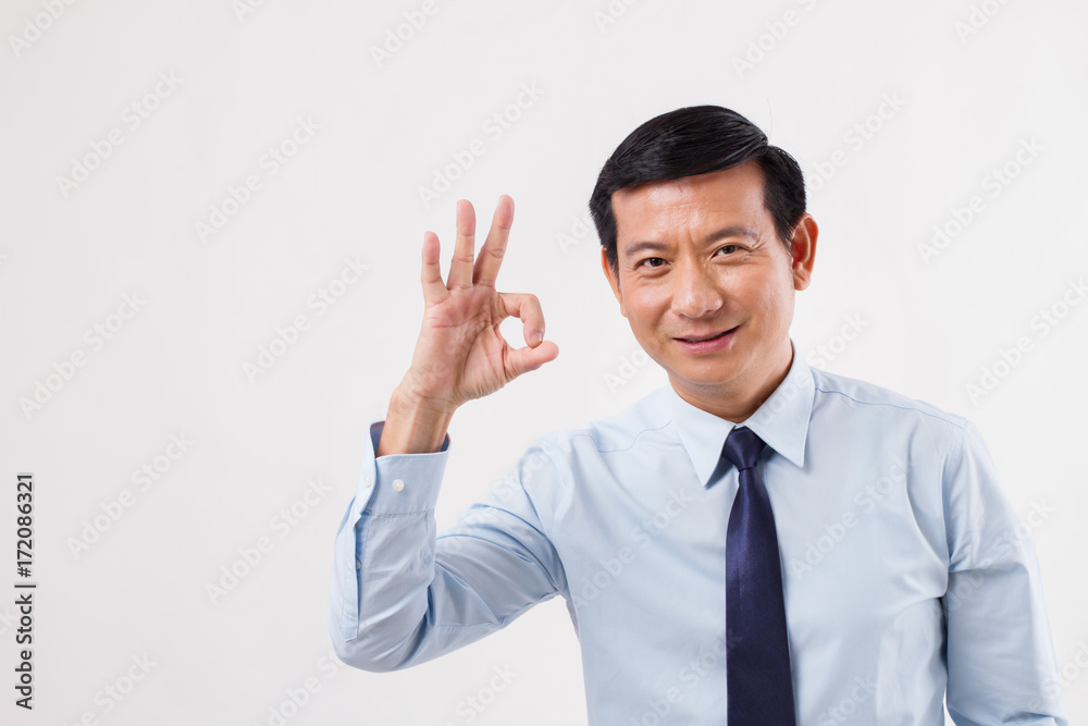 businessman pointing up ok hand gesture businessman pointing up ok hand gesture