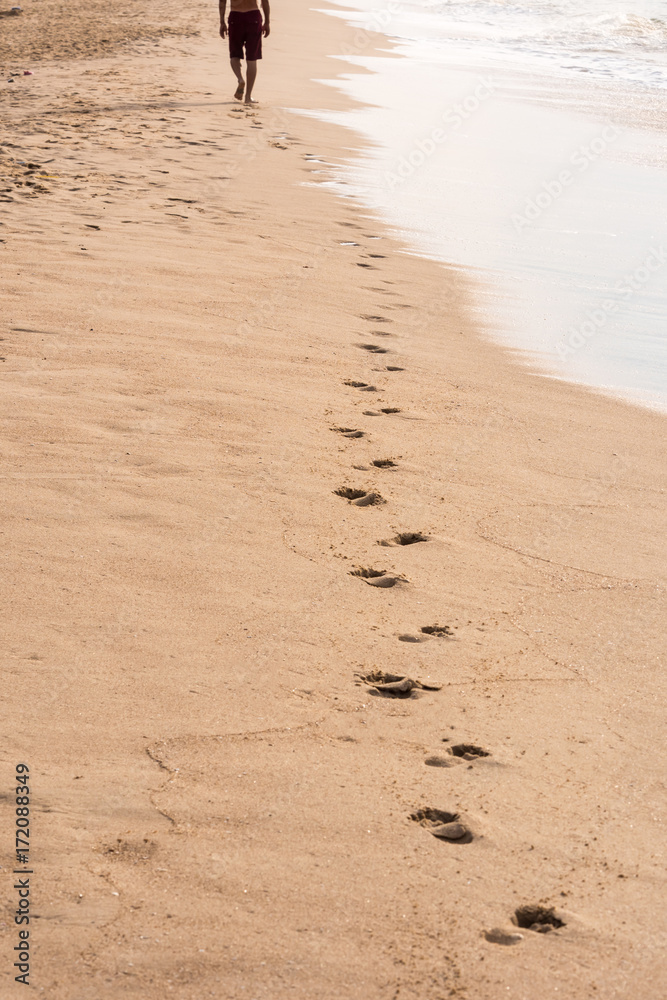 Footprints of a man walking on the beach. Travel concept Footprints of a man walking on the beach. Travel concept