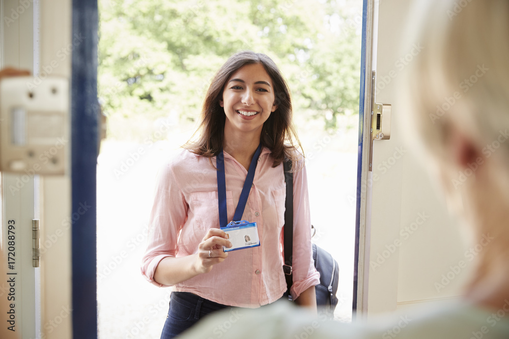 © Monkey Business - Female care worker on home visit showing her ID, close up © Monkey Business - Female care worker on home visit showing her ID, close up
