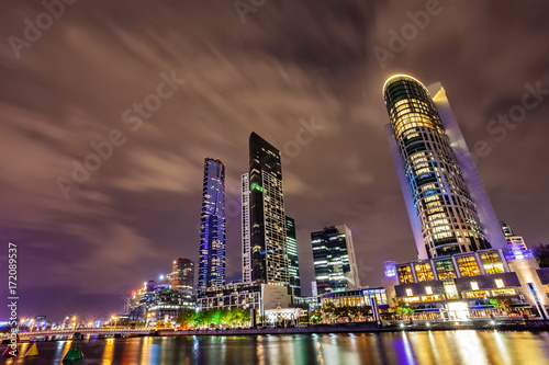 Canvas Print A view across the Yarra river at the landmark of Melbourne downtown during the city’s nightly fireshow