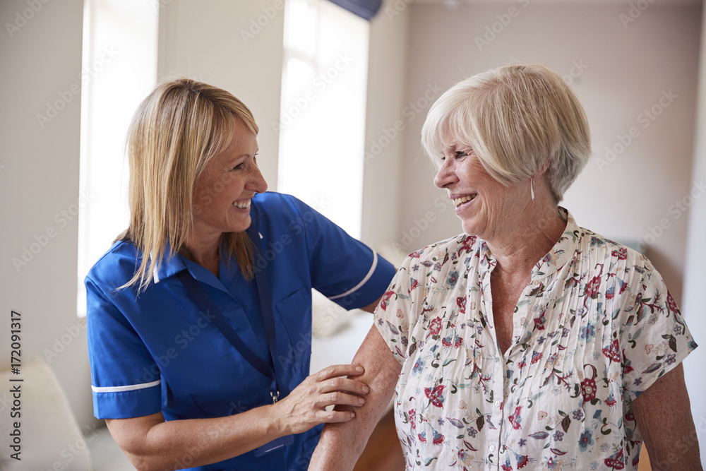 Fototapeta premium Nurse helping senior woman use a walking frame, close up