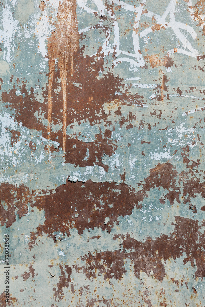 Rusty metal surface with blue paint flaking and cracking texture