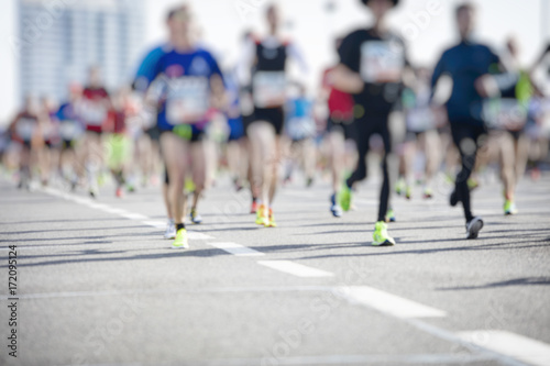 marathon runners ,motion blur running people in the city