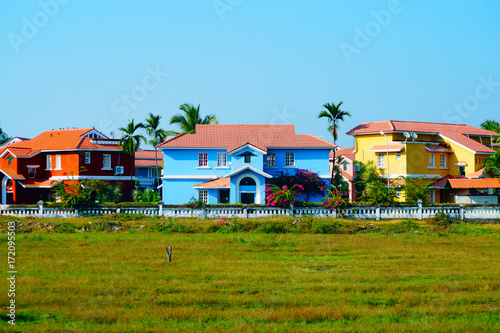 Bright colors. Blue house near the beach in Benaulim, South Goa, India. Big mansion.
