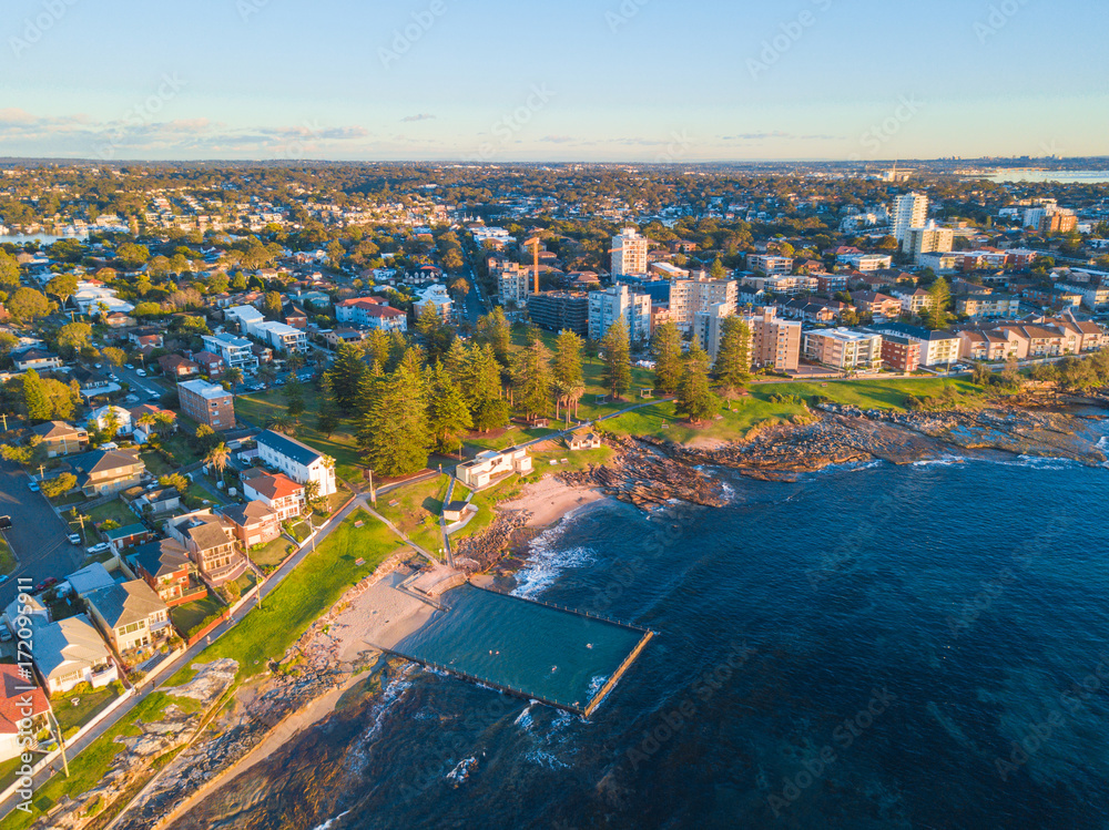 Obraz premium Aerial view of Cronulla coastline with ocean pool.