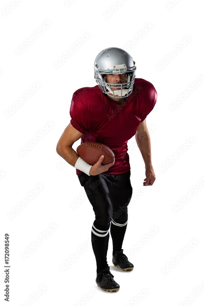 Full length of American football player wearing helmet Full length of American football player wearing helmet