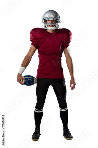 Full length of determined American football player wearing