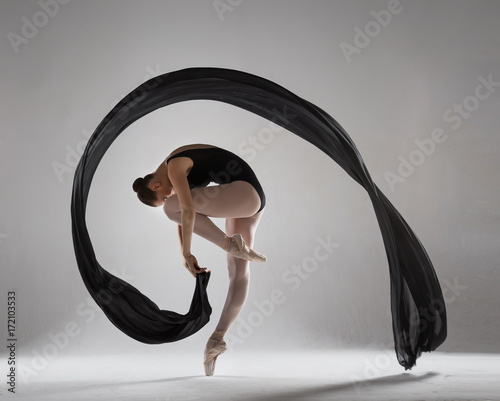 Fototapeta Naklejka Na Ścianę i Meble -  Graceful ballerina with a black veil