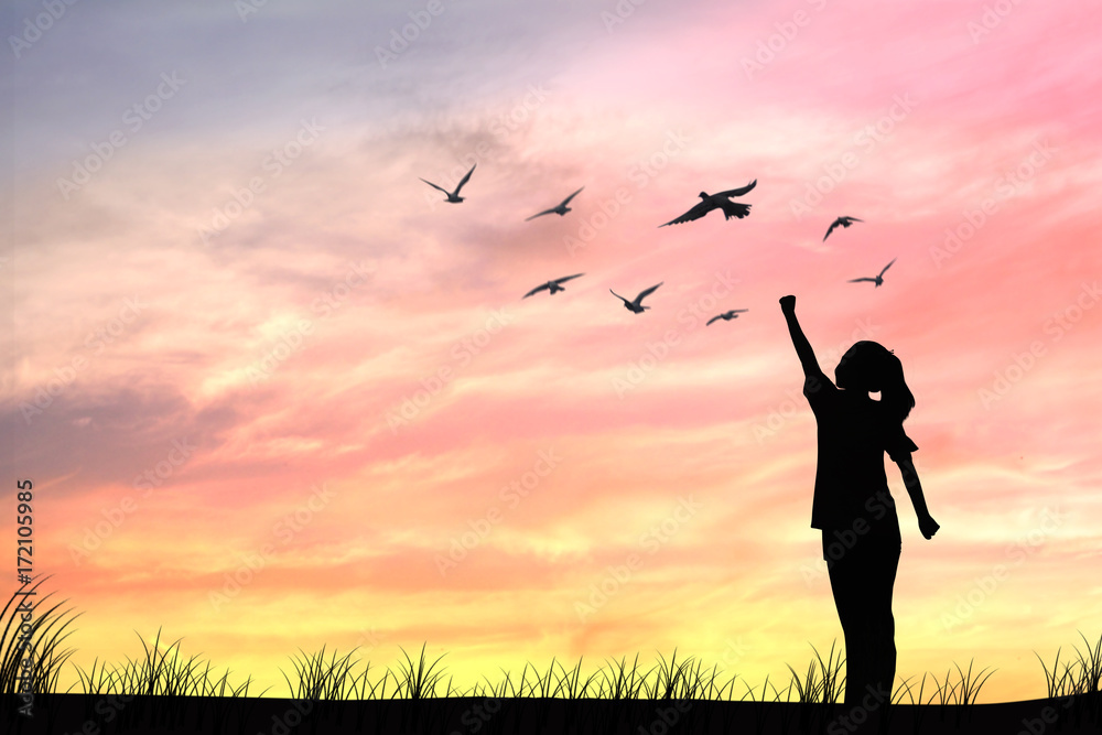 Silhouette women and dove birds flying, concept as hope and freedom