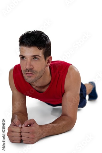 Determined sports player doing plank exercise
