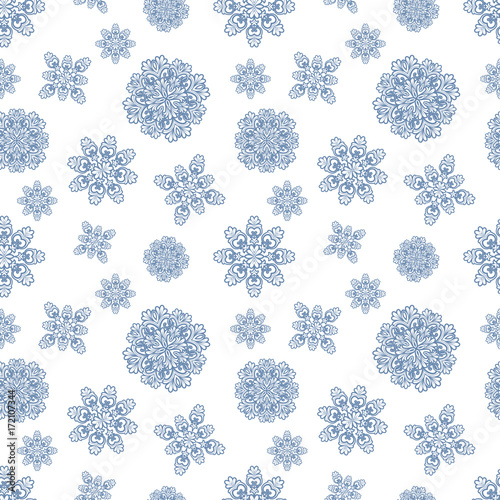 Christmas seamless pattern with blue snowflakes on white background