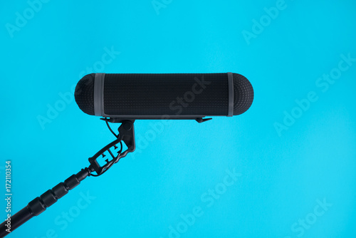  Sound recorder microphone, boom mic on blue background photo