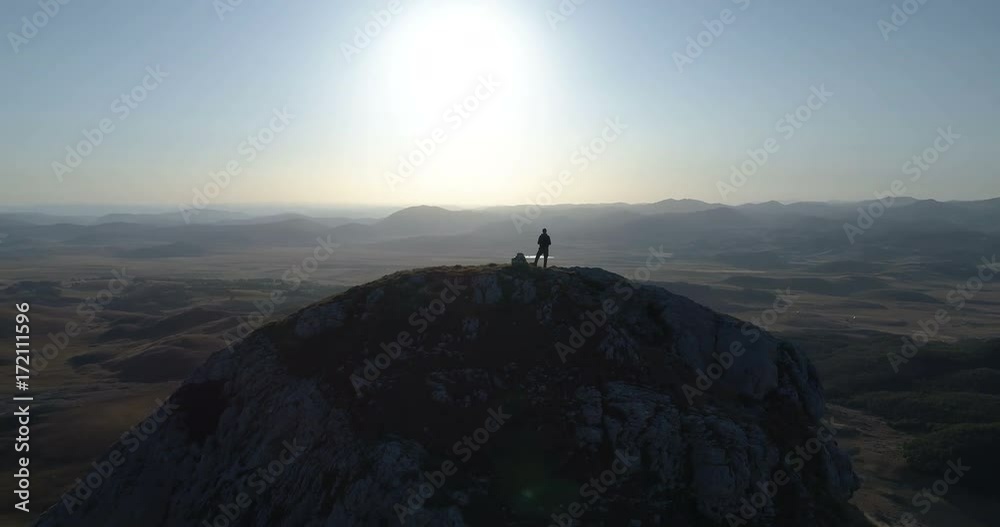 man stands on top of a mountain man stands on top of a mountain