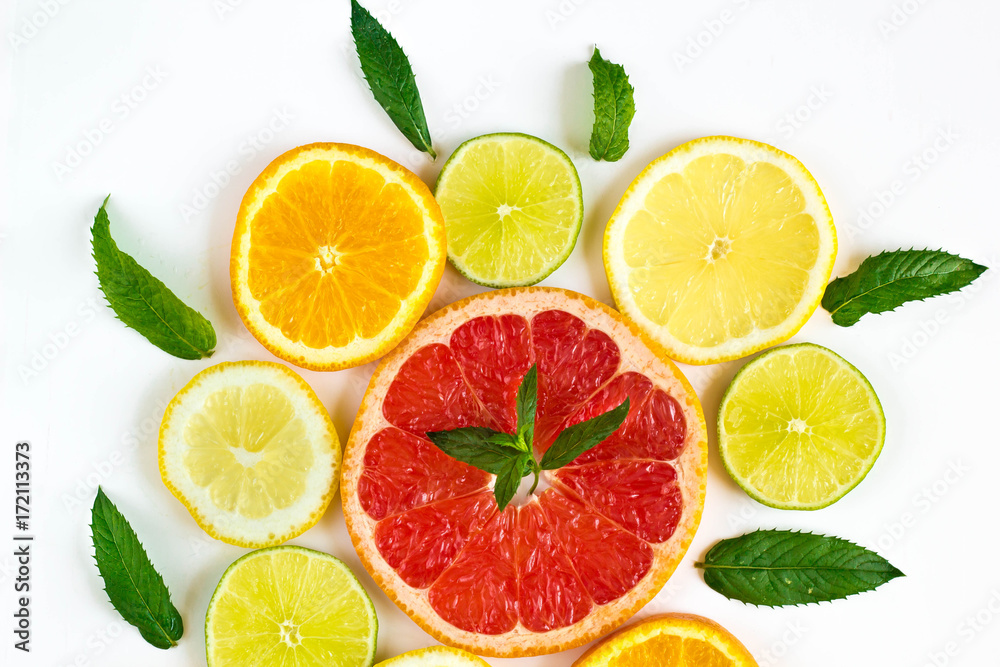 Fototapeta premium citrus food pattern on white background - assorted citrus fruits with mint leaves