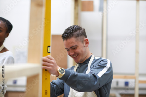 Student learning how to do building work photo
