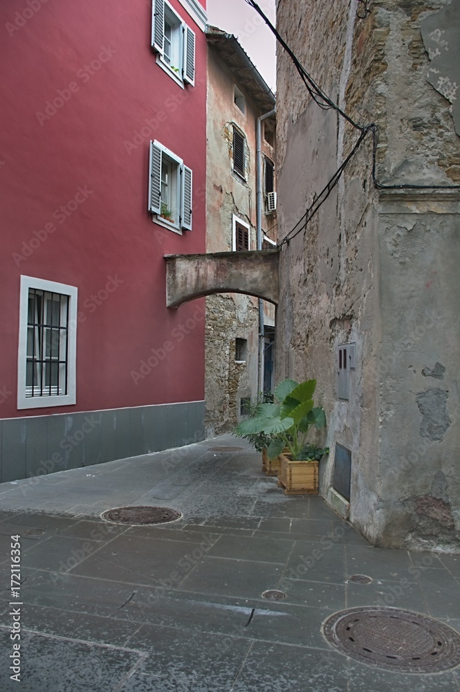 A small street in one  old Mediterranean Town - contrast repaired and old plaster