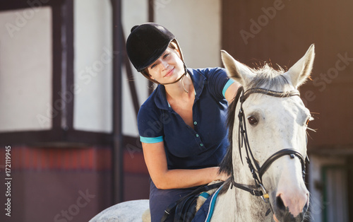Horse rider woman near stable horsewoman before training