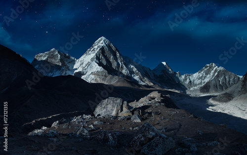 Starry night sky over the mountains,Pumori peak (7161 m), Himalayas,Nepal photo