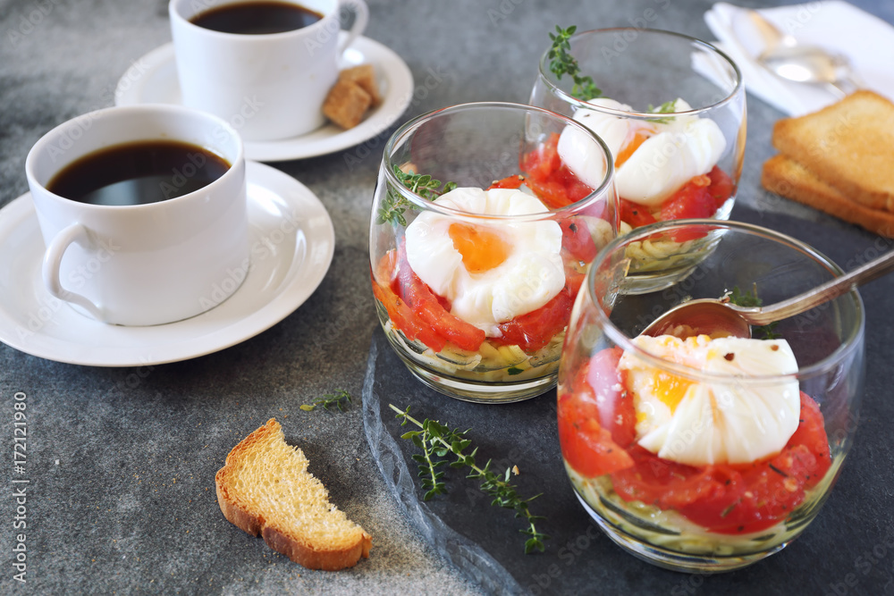 Three glasses breakfast. Poached eggs, tomatoes and zucchini and coffee