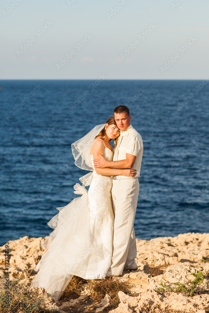 Bride and groom on a romantic moment on nature. Stylish wedding couple outdoors Bride and groom on a romantic moment on nature. Stylish wedding couple outdoors