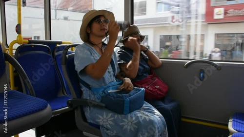 Thai women people sitting on tramway from Sandhausen district go to travel and shopping at Heidelberg altstadt or old town on August 25, 2017 in Heidelberg, Germany photo