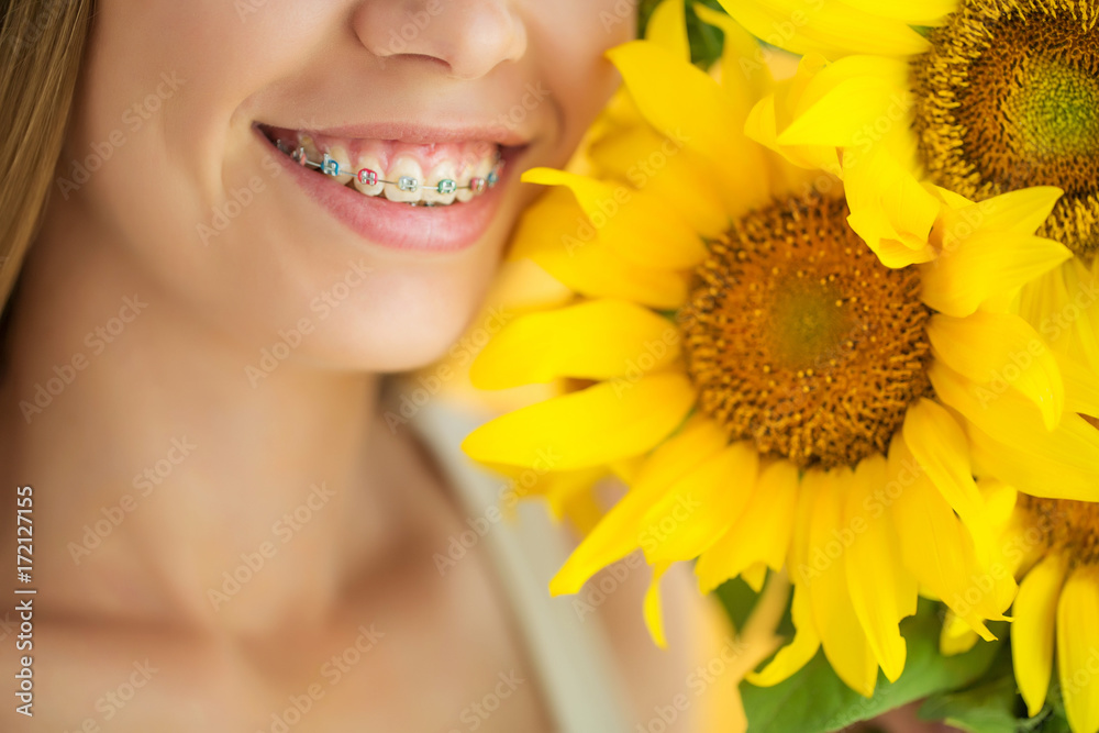 A woman is wearing braces A woman is wearing braces