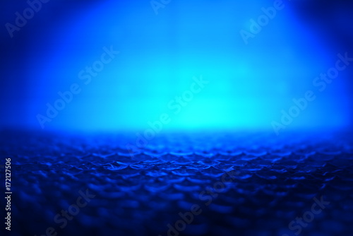 abstract background from plastic wrapper with dark blue and white light