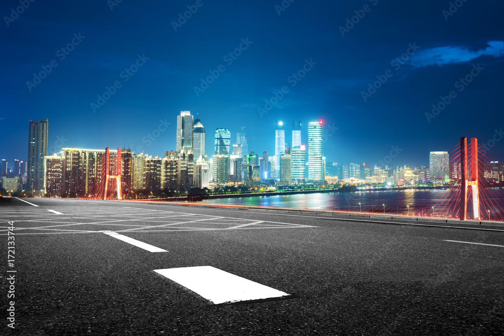 cityscape and skyline of seoul from empty road at night cityscape and skyline of seoul from empty road at night