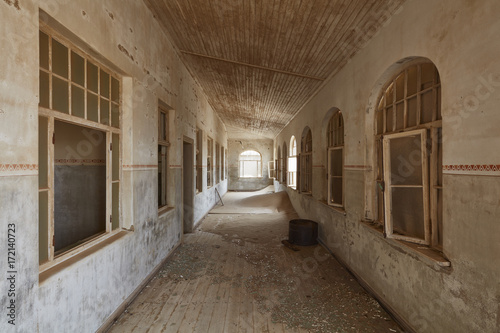 Corridor in abandoned building photo