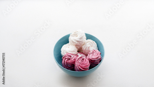 Wallpaper Mural Zephyr. Colorful sweets on teal plate closeup. Delicious confectionery, homemade dessert for breakfast Torontodigital.ca