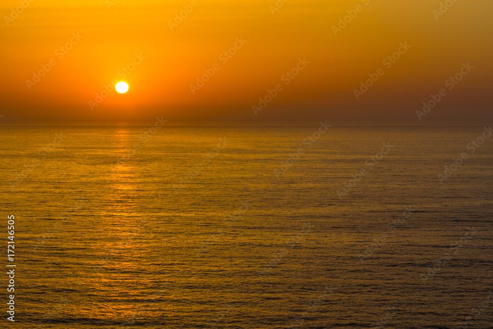 Sunset in the ocean in Arrifana