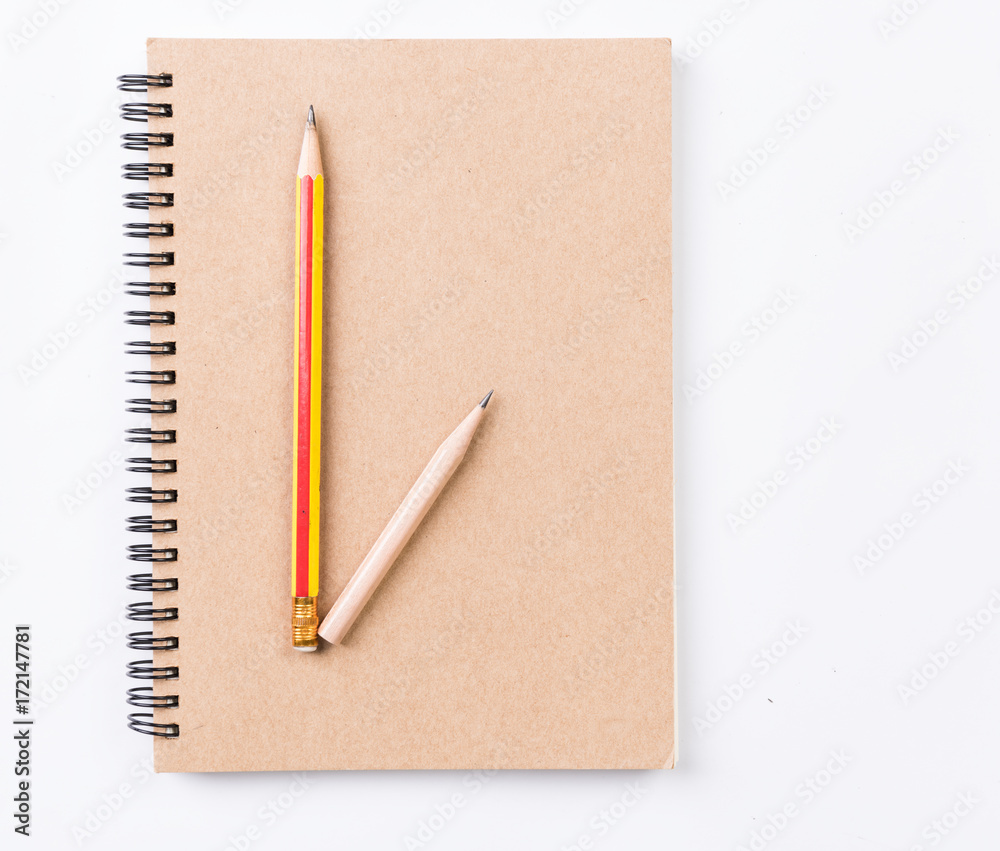 Flat lay,blank notebook and pencil isolated on white background Flat lay,blank notebook and pencil isolated on white background