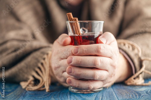 Homemade hot spiced wine in hand, mulled wine